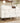 Buffet moderne blanc avec portes à motif géométrique sans poignées et tiroirs push-to-open, pieds en bois massif, idéal pour salle à manger et salon